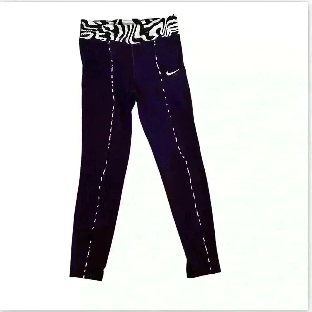 Nike Active pants size L in purple and green.